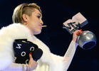 Miley Explains Decision to Light Up on Stage